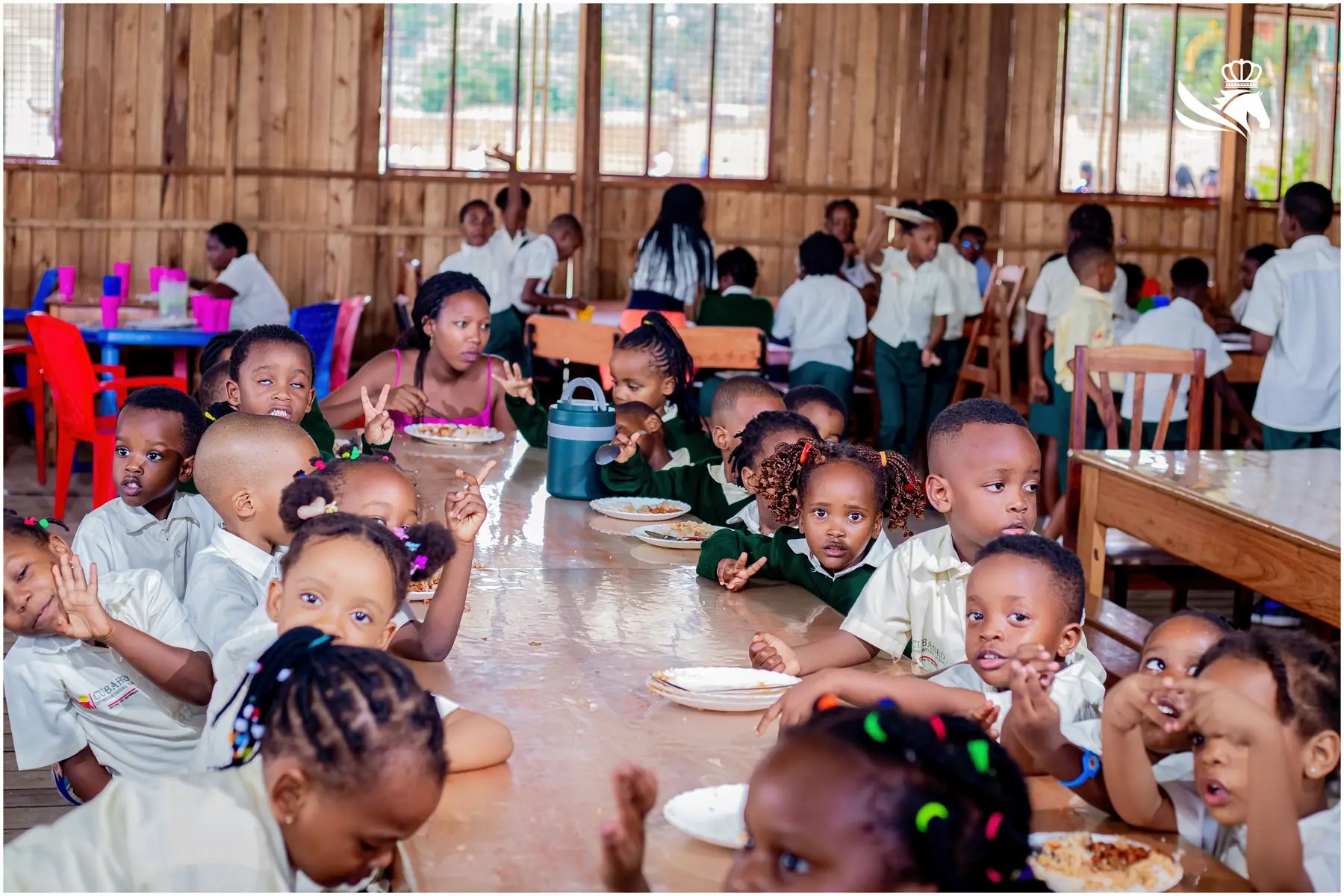 Kindergarten pupils sharing lunch together