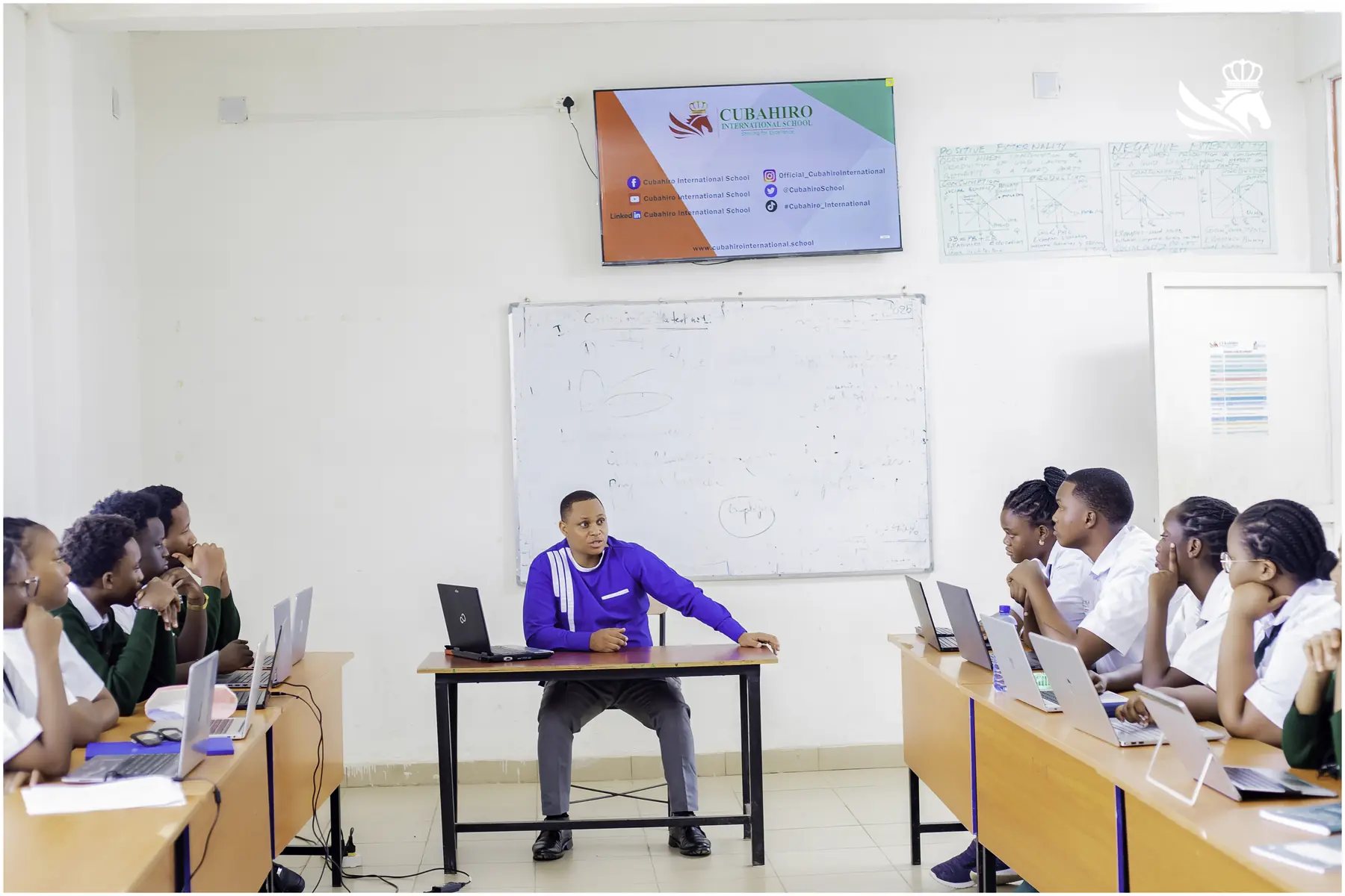 Instructor leading a practical computer-based class